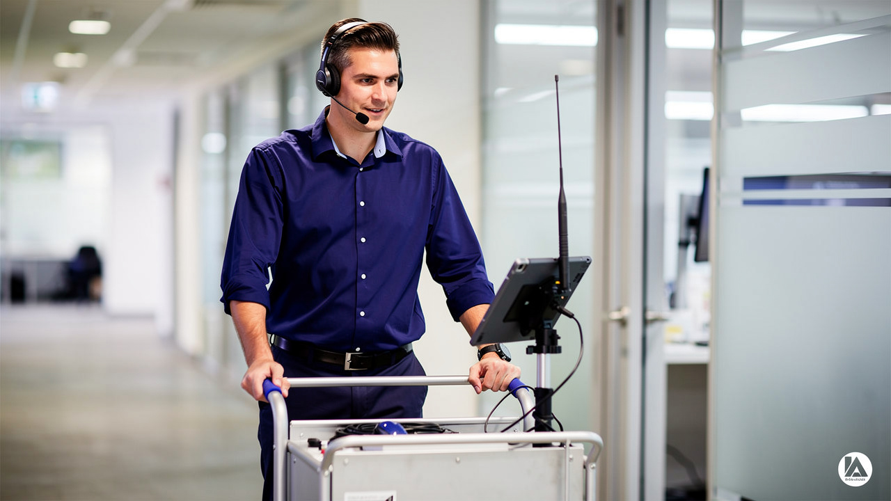 Technician performing wireless site survey in office